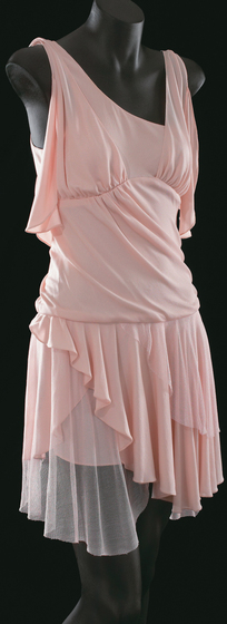 Mannequin wearing a pale pink silk jersey dress with silk net detail