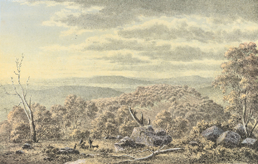 A scrubby landscape, featuring large boulders and dead trees, spanning into a distance of rolling hills. In the foreground, two men stand with a dog, surveying the scenery.