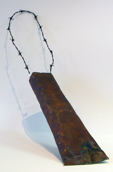 Sculpture of a bag using a sheet of tin for the body and barbed wire for the handle.
