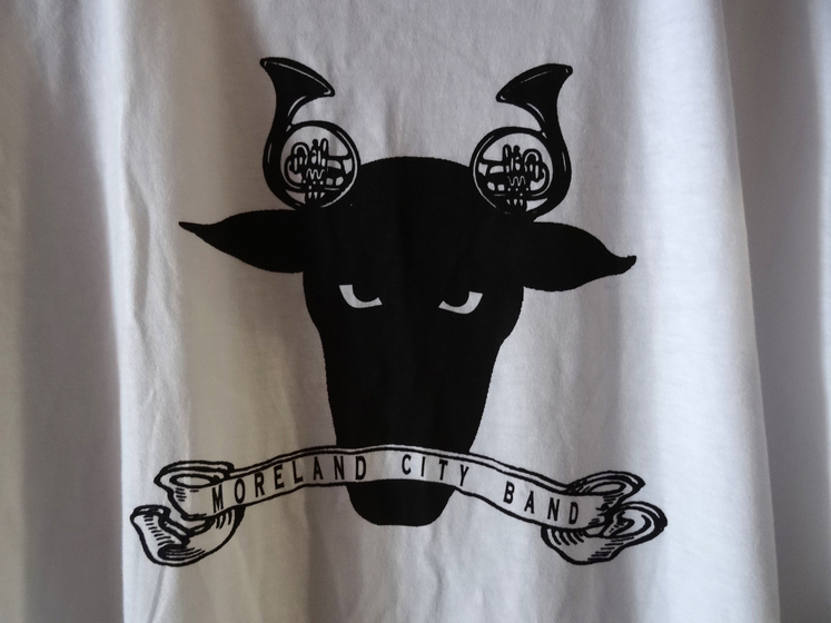 White t-shirt with a bulls head on the front, sporting two French horns where the bulls horns should be.