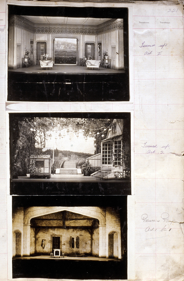 Three sepia photographs of different set designs, stuck to a scrapbook page. There are some hand written notes in the margin.