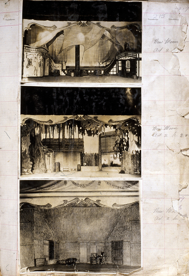 Three sepia photographs of different set designs, stuck to a scrapbook page. There are some hand written notes in the margin.