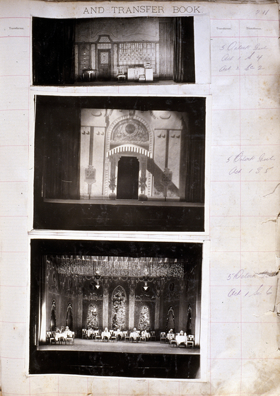 Three black and white photographs of different set designs, stuck to a scrapbook page. There are some hand written notes in the margin.