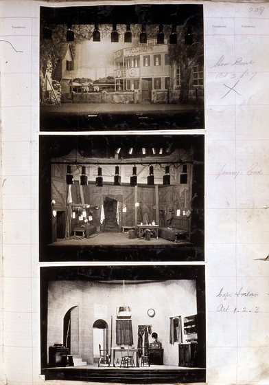 Three sepia photographs of different set designs, stuck to a scrapbook page. There are some hand written notes in the margin.