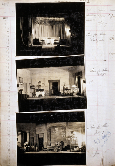 Three sepia photographs of different set designs, stuck to a scrapbook page. There are some hand written notes in the margin.