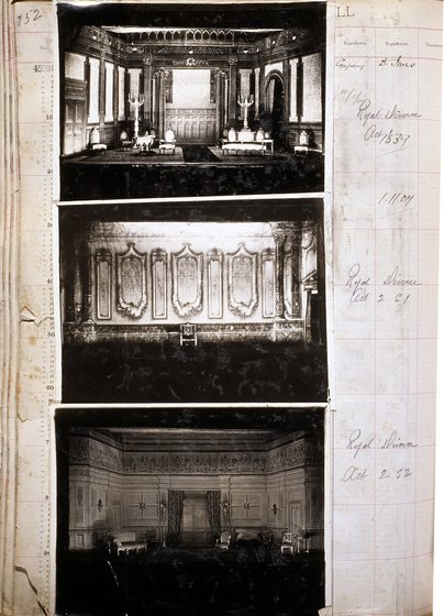 Three black and white photographs of different set designs, stuck to a scrapbook page. There are some hand written notes in the margin.