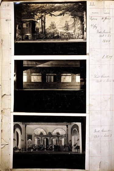 Three sepia photographs of different set designs, stuck to a scrapbook page. There are some hand written notes in the margin.