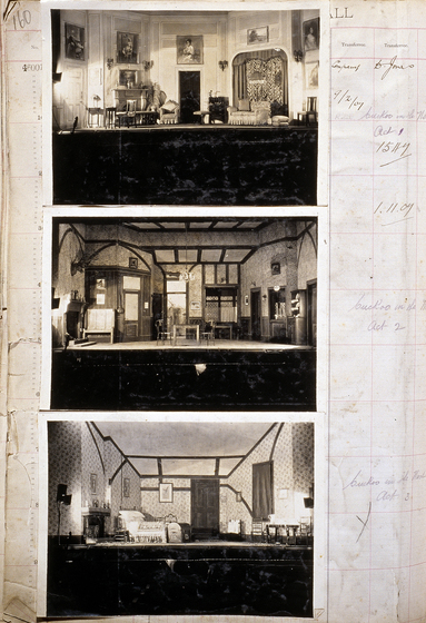 Three sepia photographs of different set designs, stuck to a scrapbook page. There are some hand written notes in the margin.