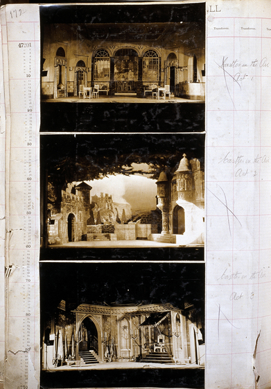 Three sepia photographs of different set designs, stuck to a scrapbook page. There are some hand written notes in the margin.