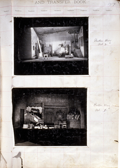 Two black and white photographs of different set designs, stuck to a scrapbook page. There are some hand written notes in the margin.