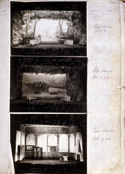 Three black and white photographs of different set designs, stuck to a scrapbook page. There are some hand written notes in the margin.