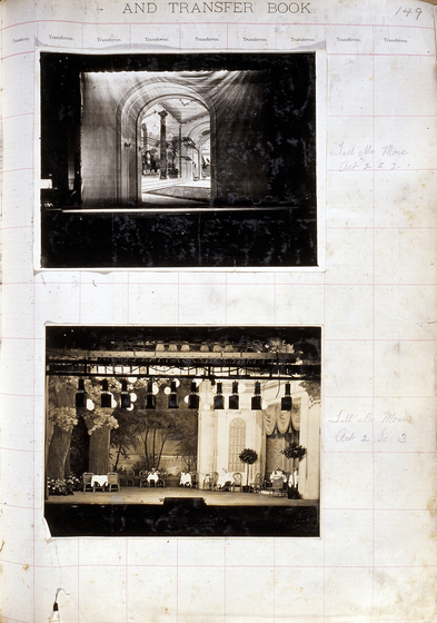 Two black and white photographs of different set designs, stuck to a scrapbook page. There are some hand written notes in the margin.