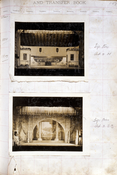Two sepia photographs of different set designs, stuck to a scrapbook page. There are some hand written notes in the margin.