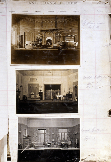 Three sepia photographs of different set designs, stuck to a scrapbook page. There are some hand written notes in the margin.