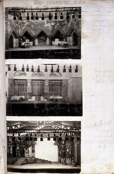 Three black and white photographs of different set designs, stuck to a scrapbook page. There are some hand written notes in the margin.