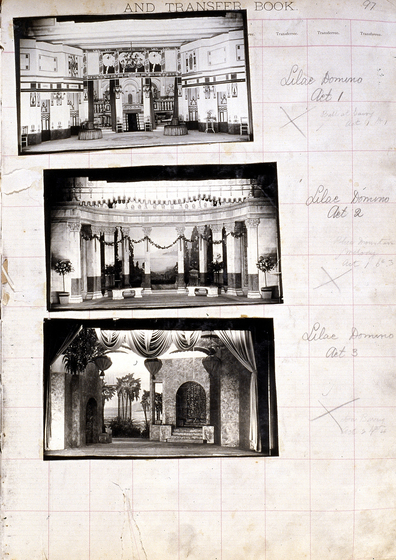 Three black and white photographs of different set designs, stuck to a scrapbook page. There are some hand written notes in the margin.