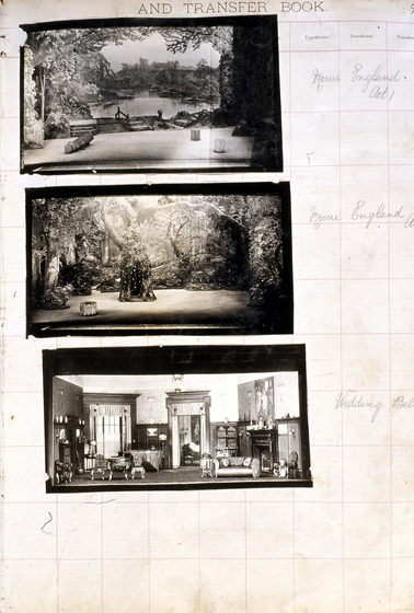 Three black and white photographs of different set designs, stuck to a scrapbook page. There are some hand written notes in the margin.
