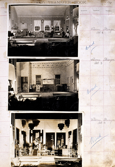Three sepia photographs of different set designs, stuck to a scrapbook page. There are some hand written notes in the margin.