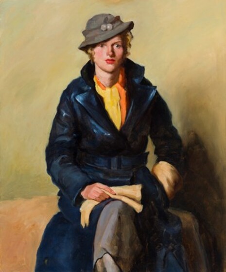 Portrait of a woman sitting on some type of bench. She is dressed in a long blue coat, yellow shirt and grey hat tipped slightly on her head. She is holding cream gloves, them resting on her knee.