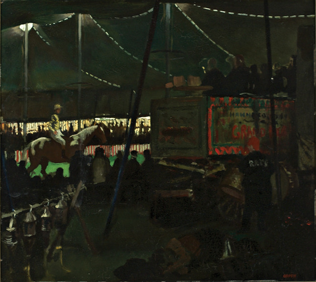 The darkened inside of a circus tent, with people walking around or watching someone ride a horse in the arena. To one side is a circus train carriage, with people sitting on top.