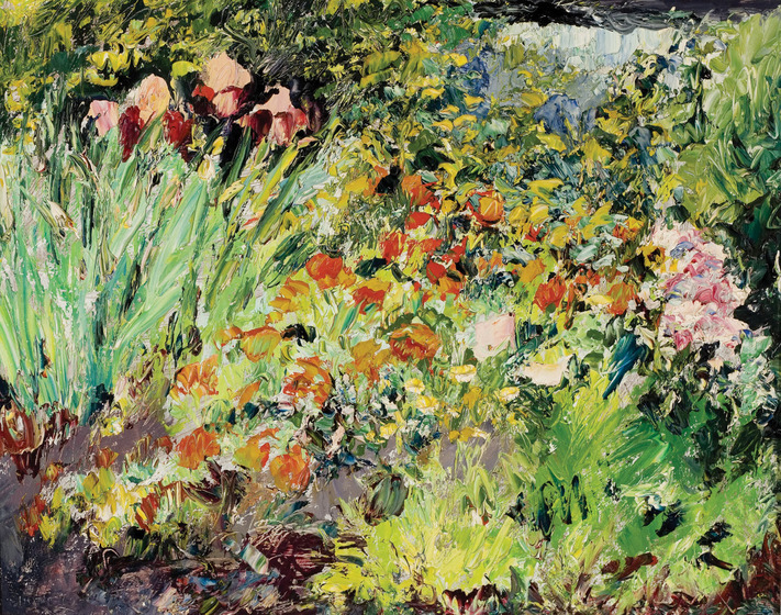 A garden scene with rows of colourful flowers and green plants and grasses.
