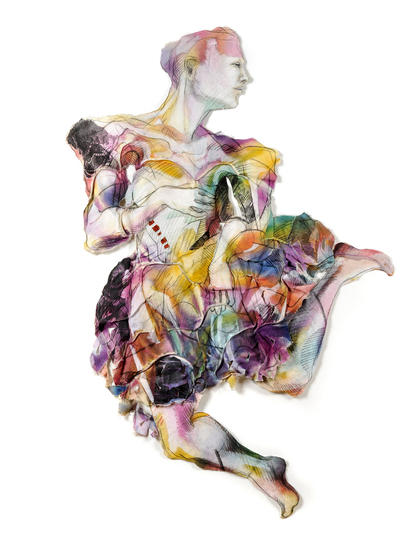 Person in a colourful dress with their legs kicked to one side and their head turned to the side.
