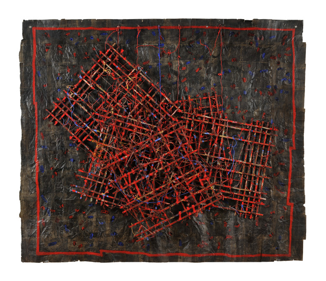 Five red square shapes, stitched on top of one another, fanning slightly out, attached to a fabric grey square.