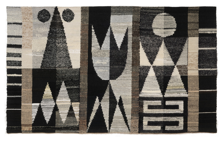 A selection of various sized shapes, including triangles, circles and diamonds, woven into a black, grey and white tapestry.