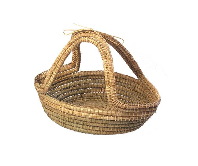 A light brown rounded basket with two thick handles looping up to touch each other.