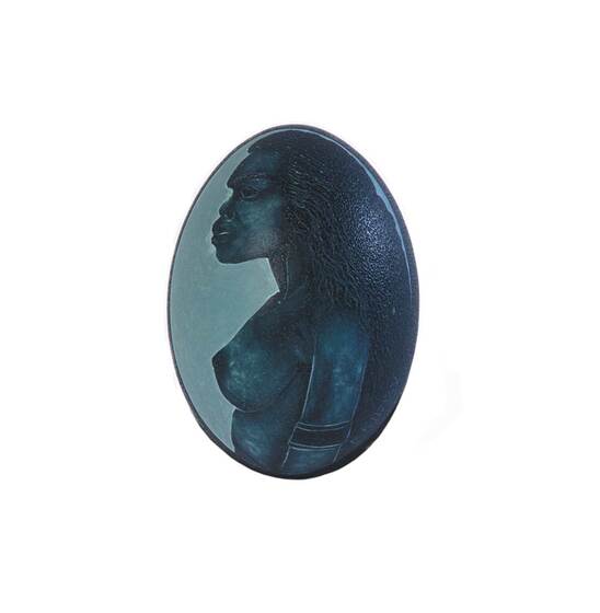 A green emu egg with a naked indigenous woman painted on the side in a profile perspective.