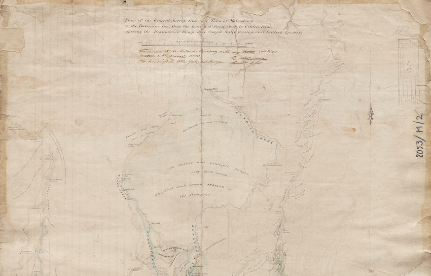 Hand drawn map on brown paper. There are lots of lines and coloured in regions to indicate topography and places. There is hand writing at the top, next to a measurement scale.