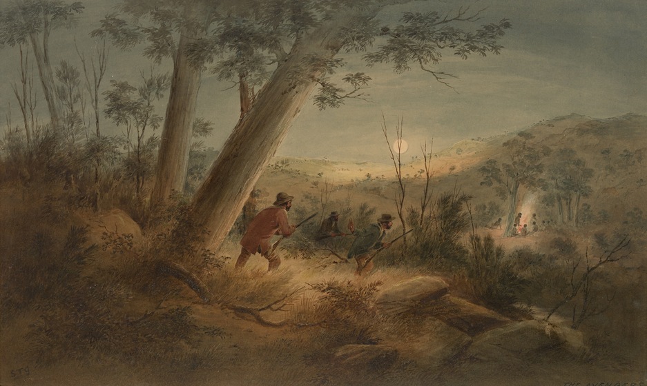 Bushland landscape, that is slightly dark with the moon rising along the horizon and shimmering over the distant hills. A group of men crouch slightly in the scrub, wearing suits, hats and holding weapons. They're overlooking a group of indigenous people, sitting around a campfire.