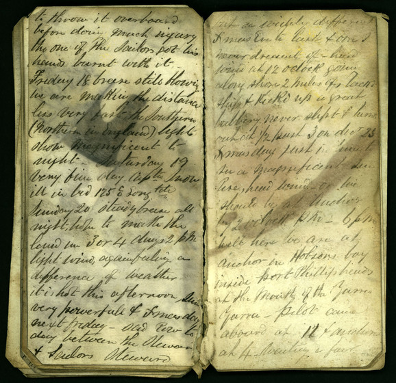 Cursive hand written diary pages on yellowing paper, slightly smudged with black ink stains