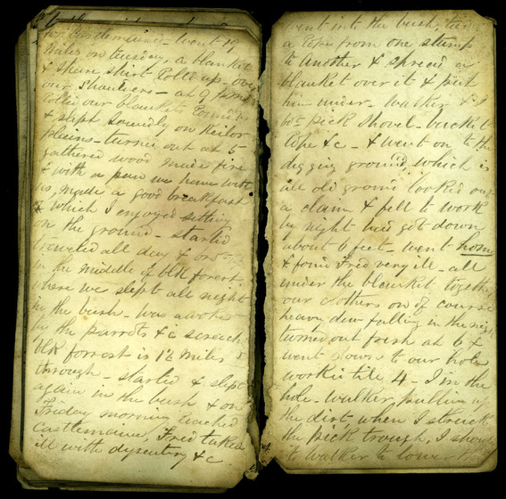 Cursive hand written diary pages on yellowing paper, slightly smudged with black ink stains