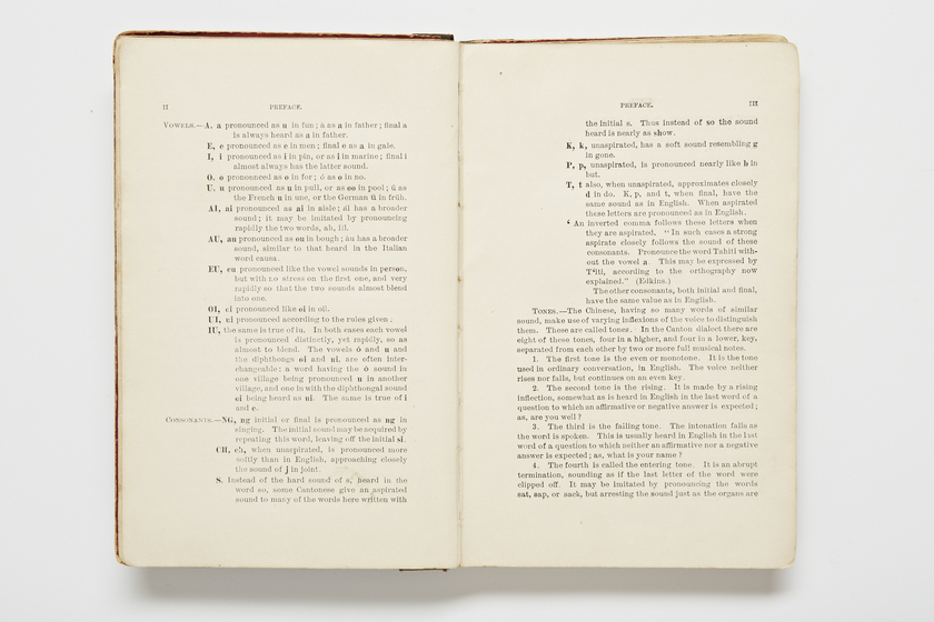 Double page book with Cantonese characters and English translations.