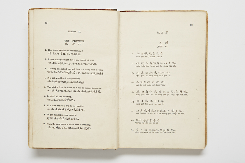 Double page book with Cantonese characters and English translations.