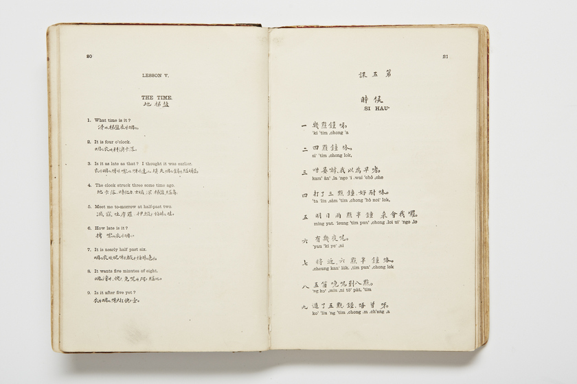 Double page book with Cantonese characters and English translations.
