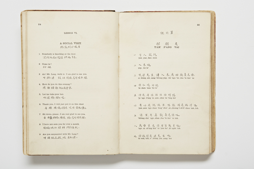Double page book with Cantonese characters and English translations.