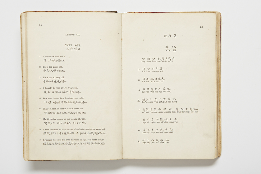 Double page book with Cantonese characters and English translations.