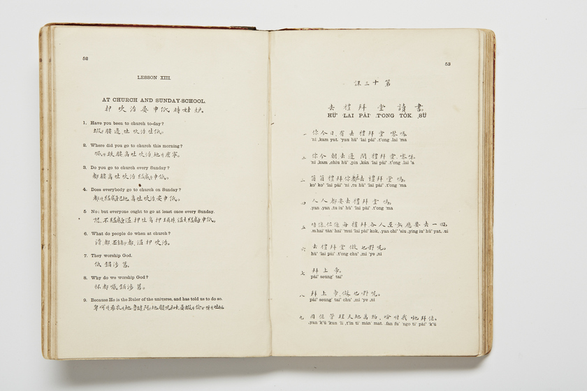 Double page book with Cantonese characters and English translations.