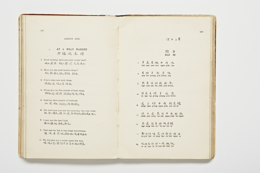 Double page book with Cantonese characters and English translations.