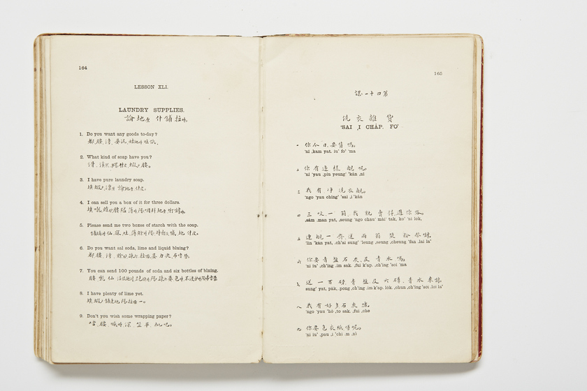 Double page book with Cantonese characters and English translations.