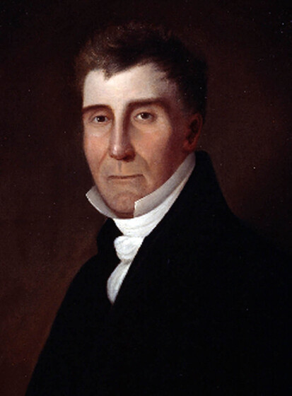 Portrait painting of a middle aged man, dressed in a black coat and a high neck white shirt and decorative collar.