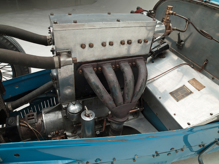 A close up side view of the cars moto.