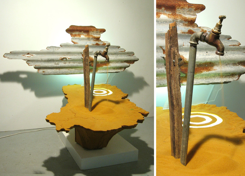 A sculpture made of a tree trunk attached to a white square plinth. Inserted into the top of the flattened tree trunk is a metal tap and wooden post. Floating behind the sculpture is a sheet of corrugated metal, shaped like a cloud.