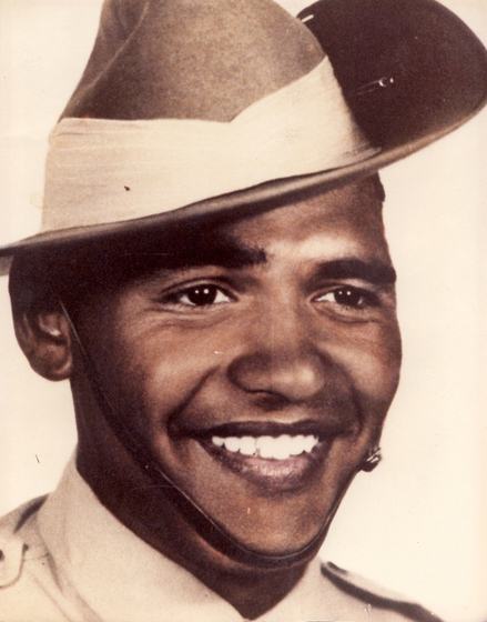 Smiling young man wearing an Australian army slouch hat, close up head-shot.