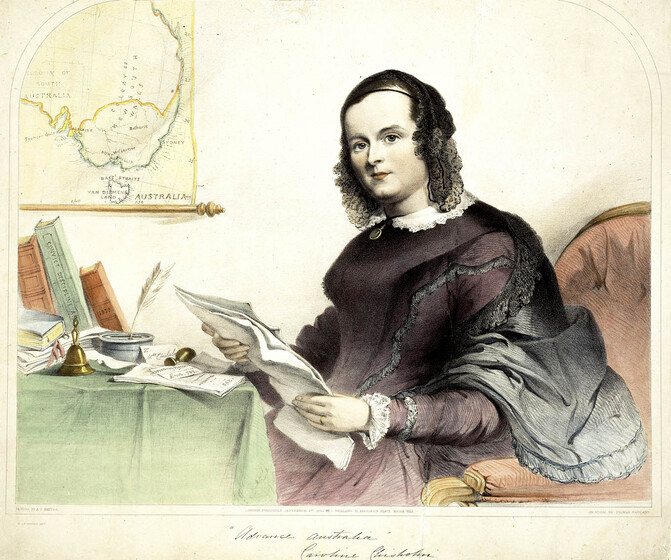 Woman in an ornate purple dress sitting in a cushioned chair at a small table with green table cloth. A map of the east coast of Australia is on the wall, and she holds papers in her hands.