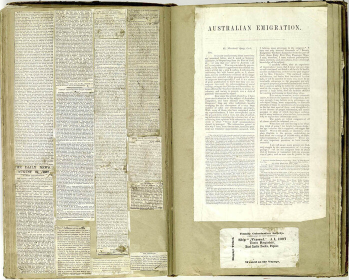 Open scrap book with articles glued in.