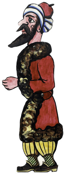 Acrylic figure of a man, jointed with pins at the waist. He has a beard, and wears a long red coat with fluffy brown trim, yellow trousers, and a red and white turban. 