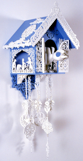 Light blue and white ornate cuckoo clock. 